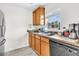 Kitchen featuring light wood cabinets, dual basin sink, stainless steel dishwasher, and a window providing natural light and fresh air at 1516 Mandarin Ct, Summerville, SC 29483
