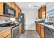 Functional kitchen with stainless steel appliances, light wood cabinets, and ample countertop space for cooking and food preparation at 1516 Mandarin Ct, Summerville, SC 29483