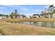 Picture of backyard pond with decorative fence between the water and well-maintained lawns at 1516 Mandarin Ct, Summerville, SC 29483