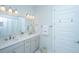 Bright bathroom with double vanity, gray cabinets, and modern fixtures at 1521 Pogonia St # 4, Mount Pleasant, SC 29466