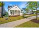 Beautiful single-Gathering home featuring a cozy front porch and lush greenery at 1521 Pogonia St # 4, Mount Pleasant, SC 29466