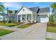 Charming single-Gathering home with a welcoming front porch and manicured lawn at 1521 Pogonia St # 4, Mount Pleasant, SC 29466