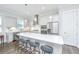 Bright kitchen with stainless appliances, gray cabinets, quartz counters, and pendant lighting over a large island at 1521 Pogonia St # 4, Mount Pleasant, SC 29466