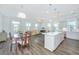 Open-concept living area with hardwood floors and plenty of natural light at 1521 Pogonia St # 4, Mount Pleasant, SC 29466