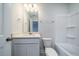 A bathroom with a shower/tub combination, vanity with cabinet storage and a framed mirror at 154 Royal Cainhoy Way, Huger, SC 29450