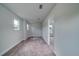 A bedroom featuring neutral paint and carpet, with a doorway leading to another room at 154 Royal Cainhoy Way, Huger, SC 29450