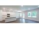 Open concept kitchen, showcasing a large island, stainless steel appliances, and an adjacent living area at 154 Royal Cainhoy Way, Huger, SC 29450