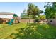 A well-maintained backyard featuring a playground, hammock, and a spacious grassy area, perfect for outdoor activities at 1606 Stovall Ct, Johns Island, SC 29455