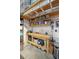 Organized basement workshop with wooden work bench, shelving, and plenty of storage at 1606 Stovall Ct, Johns Island, SC 29455