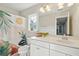 Clean bathroom with white cabinets, a decorative shower curtain, and a large mirror at 1606 Stovall Ct, Johns Island, SC 29455