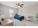 Cheerful bedroom with a ceiling fan, window, toys and a comfortable bed at 1606 Stovall Ct, Johns Island, SC 29455