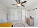 Well-lit bedroom with a fan, toy kitchen, and large closet at 1606 Stovall Ct, Johns Island, SC 29455