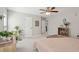 A cozy bedroom with a ceiling fan and comfortable furnishings creates a relaxing atmosphere at 1606 Stovall Ct, Johns Island, SC 29455