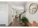 Welcoming entryway features wood flooring, a stylish mirror, staircase, and plants that enhance the inviting atmosphere at 1606 Stovall Ct, Johns Island, SC 29455