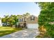 Charming two-story home features a well-manicured lawn, inviting curb appeal, and an attached two-car garage at 1606 Stovall Ct, Johns Island, SC 29455