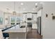 Modern kitchen showcasing granite countertops, white cabinetry, stainless steel appliances, and pendant lights above island at 1606 Stovall Ct, Johns Island, SC 29455