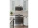 Well-equipped kitchen features stainless steel appliances, tiled backsplash, and ample counter space for culinary adventures at 1606 Stovall Ct, Johns Island, SC 29455