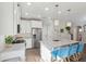 Bright kitchen boasts granite countertops, stainless steel appliances, and a stylish island with pendant lighting at 1606 Stovall Ct, Johns Island, SC 29455