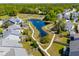 Aerial view of a community featuring a pond with walking trails and a playground, offering recreational amenities at 1606 Stovall Ct, Johns Island, SC 29455