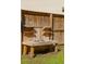 Handcrafted outdoor sink features rustic wood construction, double basin, and convenient shelving for storage, ideal for gardening at 1606 Stovall Ct, Johns Island, SC 29455