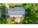 An aerial view of the house showing its gray roof, long driveway, patio area, and lush backyard at 1621 Wannamaker Ave, Summerville, SC 29485