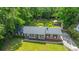 Aerial view of brick home with well-maintained lawn, mature trees, and detached structure in the expansive backyard at 1621 Wannamaker Ave, Summerville, SC 29485