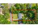 Aerial view of home and property lines surrounded by mature trees and neighboring houses in a residential area at 1621 Wannamaker Ave, Summerville, SC 29485