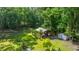 A beautiful backyard features lush landscaping and a storage shed at 1621 Wannamaker Ave, Summerville, SC 29485