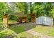 Backyard with a shed, carport, and wood storage at 1621 Wannamaker Ave, Summerville, SC 29485