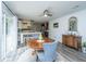 Bright dining area adjacent to the kitchen, with a ceiling fan and sliding doors to the backyard at 1621 Wannamaker Ave, Summerville, SC 29485