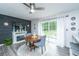 Cozy dining area with fireplace, modern lighting, and sliding doors to the backyard at 1621 Wannamaker Ave, Summerville, SC 29485