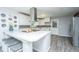 Open concept kitchen showcasing the island and seating, stainless appliances, and ample countertop space at 1621 Wannamaker Ave, Summerville, SC 29485