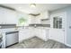 Updated kitchen featuring stainless steel appliances, granite countertops, and a convenient layout at 1621 Wannamaker Ave, Summerville, SC 29485
