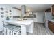 Bright kitchen island with barstool seating and stainless appliances at 1621 Wannamaker Ave, Summerville, SC 29485