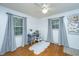 This home office features windows overlooking a beautiful view at 1621 Wannamaker Ave, Summerville, SC 29485