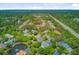 Expansive aerial view of a neighborhood with mature trees, a pond, and easy access to the highway at 1650 Long Grove Dr, Mount Pleasant, SC 29464