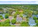 Stunning aerial view of a two-story home with lush landscaping and a large, tree-filled neighborhood at 1650 Long Grove Dr, Mount Pleasant, SC 29464