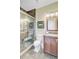 Bathroom featuring tiled shower, toilet, granite vanity, and decorative mirror at 1650 Long Grove Dr, Mount Pleasant, SC 29464