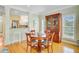 Dining room with hardwood floors, dining table, chairs, and china cabinet at 1650 Long Grove Dr, Mount Pleasant, SC 29464