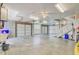 Spacious garage with two garage doors and a staircase at 1650 Long Grove Dr, Mount Pleasant, SC 29464