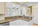 Granite counters and stainless appliances accent this bright kitchen open to living area at 1650 Long Grove Dr, Mount Pleasant, SC 29464