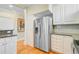 Kitchen with stainless steel refrigerator, appliances, and white cabinetry at 1650 Long Grove Dr, Mount Pleasant, SC 29464