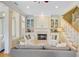 Cozy living area with a fireplace, built-in shelving, and comfortable seating creating an inviting ambiance at 1650 Long Grove Dr, Mount Pleasant, SC 29464