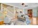 Comfortable living room with hardwood floors, stairway and open floor plan to kitchen at 1650 Long Grove Dr, Mount Pleasant, SC 29464