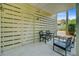 Exterior view of the cozy outdoor patio area with ample seating and privacy from the surrounding greenery at 1650 Long Grove Dr, Mount Pleasant, SC 29464