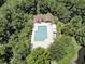 Stunning aerial view of a community pool area nestled amongst lush greenery, with lounge chairs and cabana at 1650 Long Grove Dr, Mount Pleasant, SC 29464