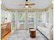 Sunroom with windows, curtains, ceiling fan, and comfortable seating with a view at 1650 Long Grove Dr, Mount Pleasant, SC 29464