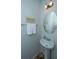 Stylish powder room with pedestal sink, oval mirror, and decorative accents at 1823 Chauncys Ct, Mount Pleasant, SC 29466