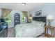 Bedroom with a lush green patterned comforter and outdoor view at 1823 Chauncys Ct, Mount Pleasant, SC 29466