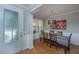 Elegant dining room with hardwood floors, wainscoting, and stylish light fixture at 1823 Chauncys Ct, Mount Pleasant, SC 29466
